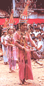 Beautiful girls dancing in colorful local dresses.